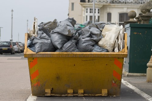 Construction site with builders waste being cleared